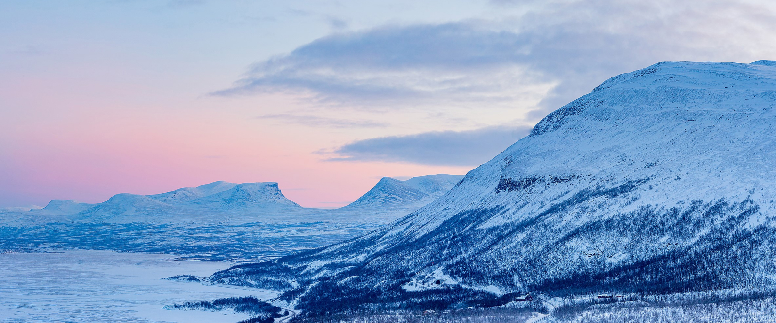 Polar landscape with big snow covered mountain and forest