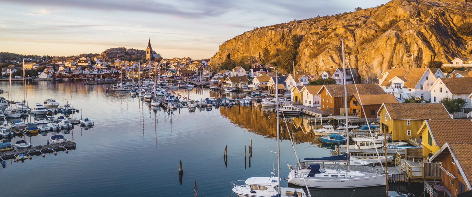 swedish small coastal village harbour with lots of small boats